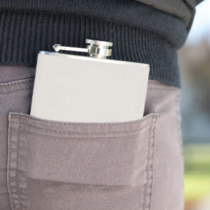 a black and white photo of a man in a suit and tie hip flask