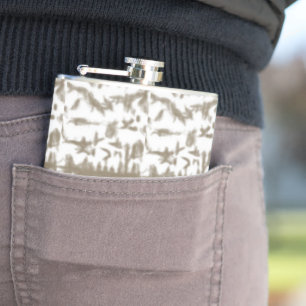 a black and white photo of a pattern hip flask