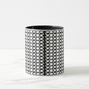 a black and white photo of a pattern mug