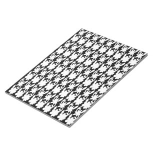 a black and white photo of a pattern notepad