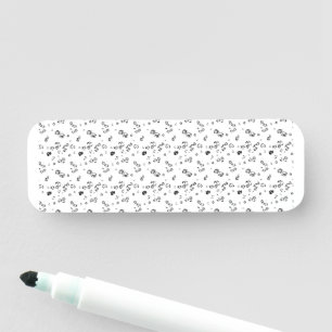 a black and white photo of bubbles on a white back name tag