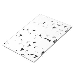 a black and white photo of rain drops notepad