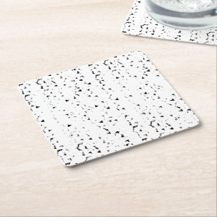 a black and white photo of rain drops square paper coaster