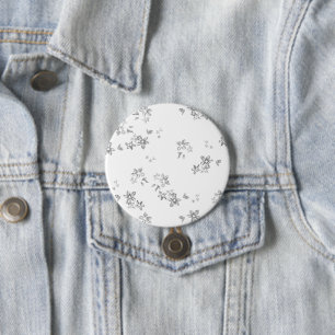 a black and white photo of snow flakes 3 inch round button
