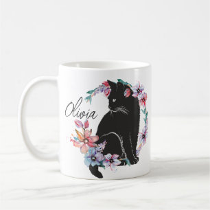 A black cat surrounded by flowers coffee mug