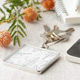 a black frame with a white background with lines keychain