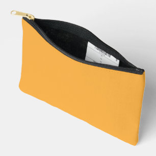 A blend of yellow and orange hues creates a vibran accessory pouch