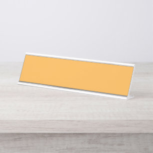 A blend of yellow and orange hues creates a vibran desk name plate