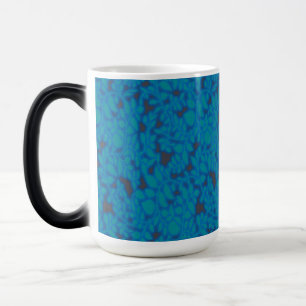 a blue and black background with a pattern magic mug