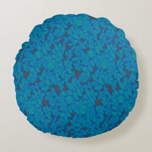 a blue and black background with a pattern round pillow