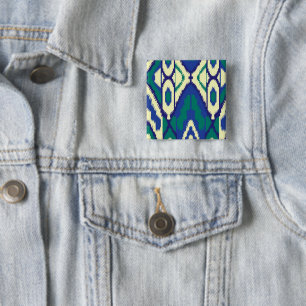 a blue and green pattern with a white background 2 inch square button