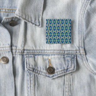 a blue and green pattern with a white background 2 inch square button