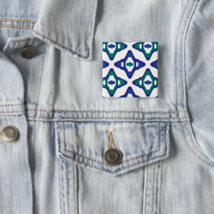 a blue and green pattern with a white background 2 inch square button