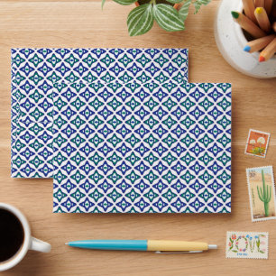 a blue and green pattern with a white background envelope