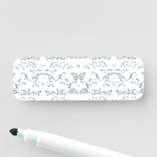a blue and white wallpaper with a pattern on it name tag