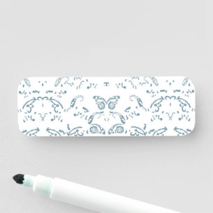 a blue and white wallpaper with a pattern on it name tag