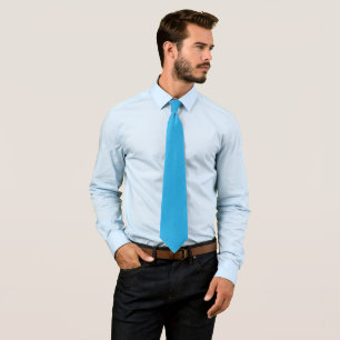 a blue background with a black and white cat tie