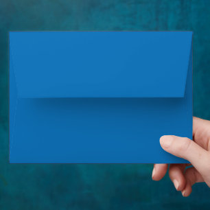 a blue background with a black and white clock envelope