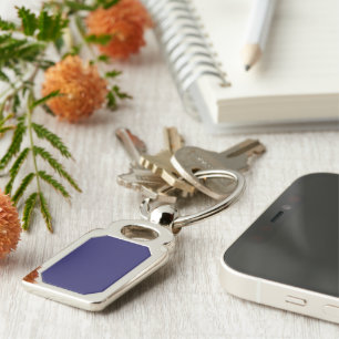 a blue background with a clock on it keychain