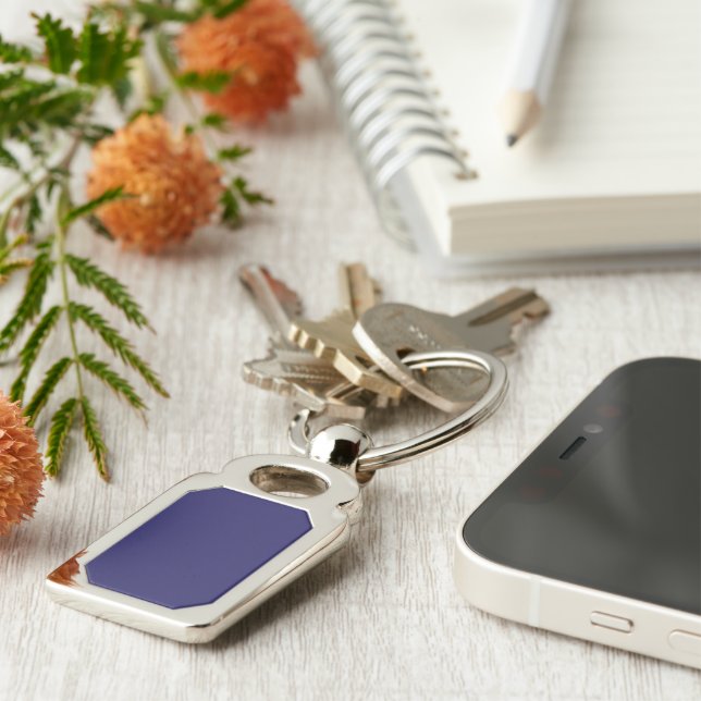 a blue background with a clock on it keychain (Side)
