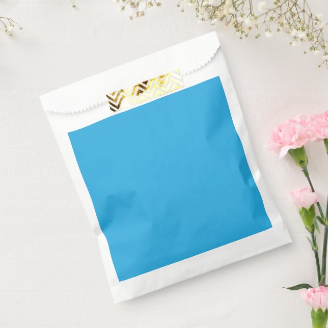 a blue background with a favour bag (Sealed)