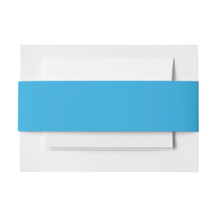 a blue background with a invitation belly band