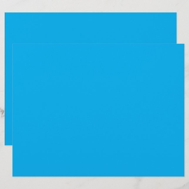 a blue sky with a plane flying in the sky letterhead (Front/Back)