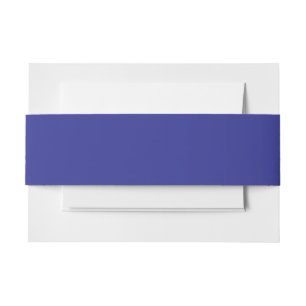 a blue wall with a clock invitation belly band