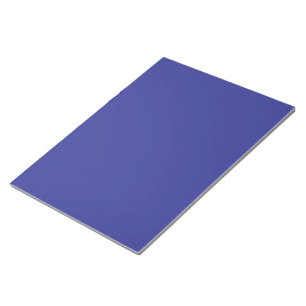 a blue wall with a clock on it notepad