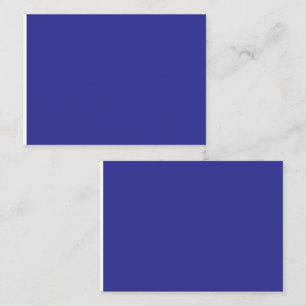 a blue wall with a clock  place card