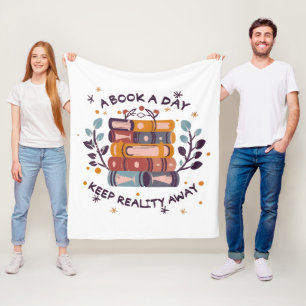 A book a day keep reality away fleece blanket