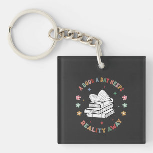 A Book A Day Keeps Reality Away  Keychain