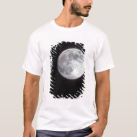 A bright full moon in a black night sky.