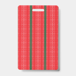 A bright red apple sits on a plain white surface. badge