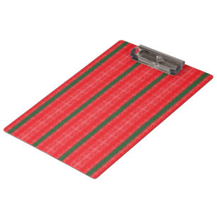 A bright red apple sits on a plain white surface. clipboard