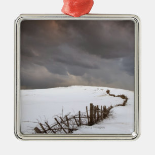 A Broken Fence Along A Snow Covered Field Metal Ornament