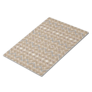a brown and blue pattern on a white background notepad