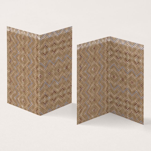 A brown rug displaying a symmetrical design featur (Inside and Outside)