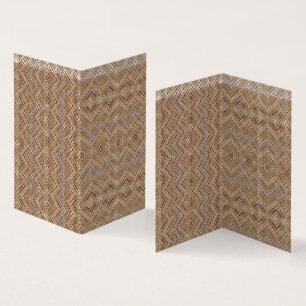 A brown rug displaying a symmetrical design featur