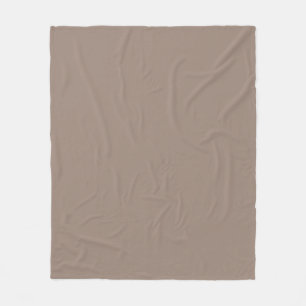 a brown wall with a clock on it fleece blanket