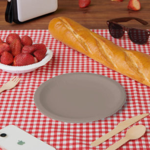 a brown wall with a clock on it paper plate