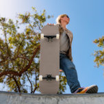 a brown wall with a clock on it skateboard<br><div class="desc">The image is a close-up of a beige wall, which appears to be a part of a building. The wall is smooth and has a uniform texture, giving it a plain and simple appearance.</div>