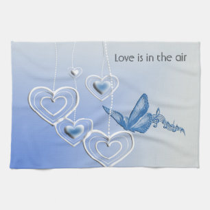 A butterfly and hearts kitchen towel