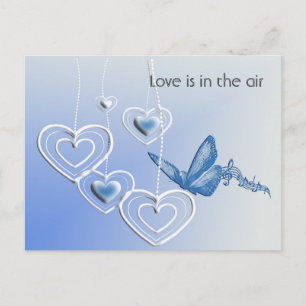 A butterfly and hearts postcard