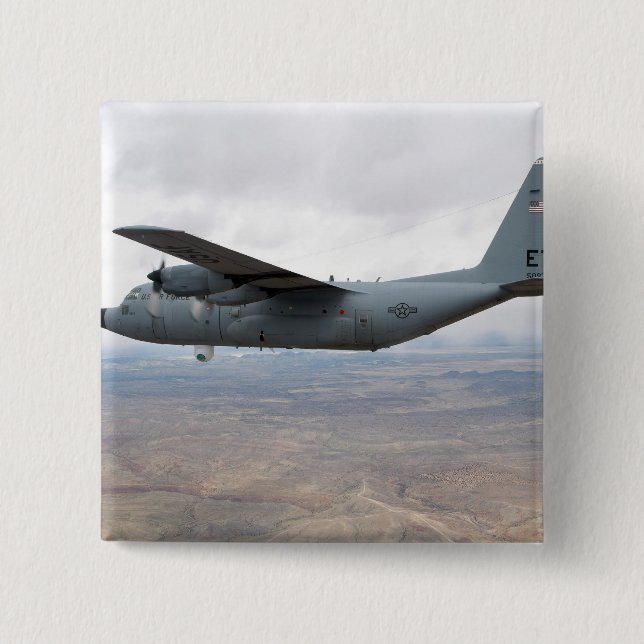 A C-130 Hercules soars through the sky 2 Inch Square Button (Front)