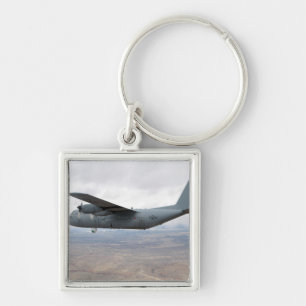 A C-130 Hercules soars through the sky Keychain