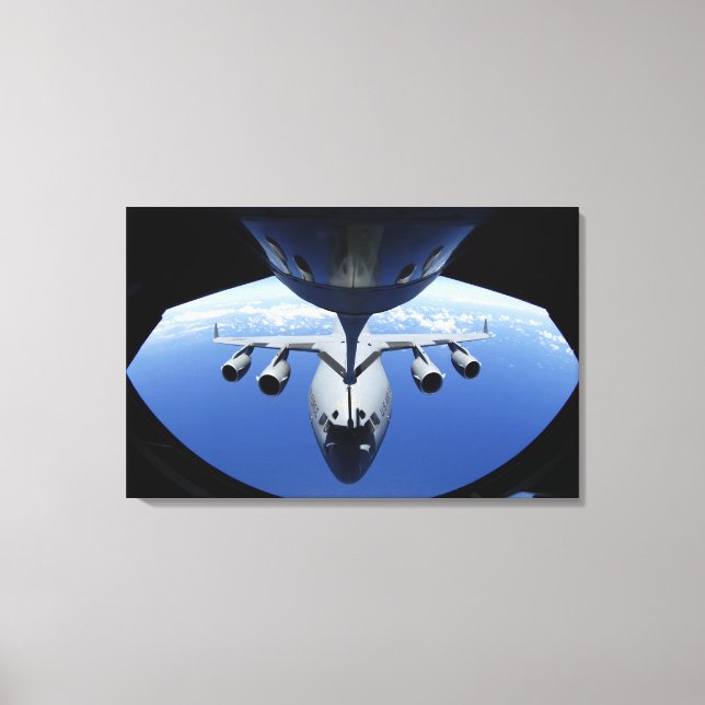 A C-17 Globemaster III receives fuel Canvas Print (Front)