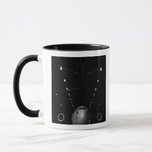 A C-17 Globemaster III sits in a hangar Mug