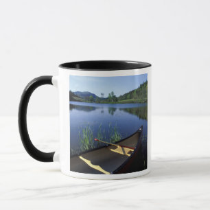 A canoe rests on the shore of Little Long Pond Mug
