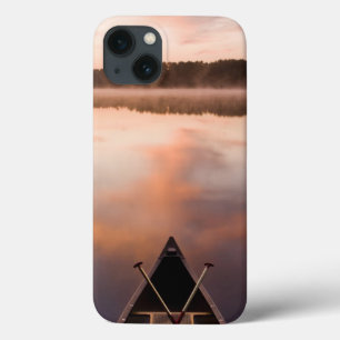 A canoe rests on the shore of Pawtuckaway Lake iPhone 13 Case
